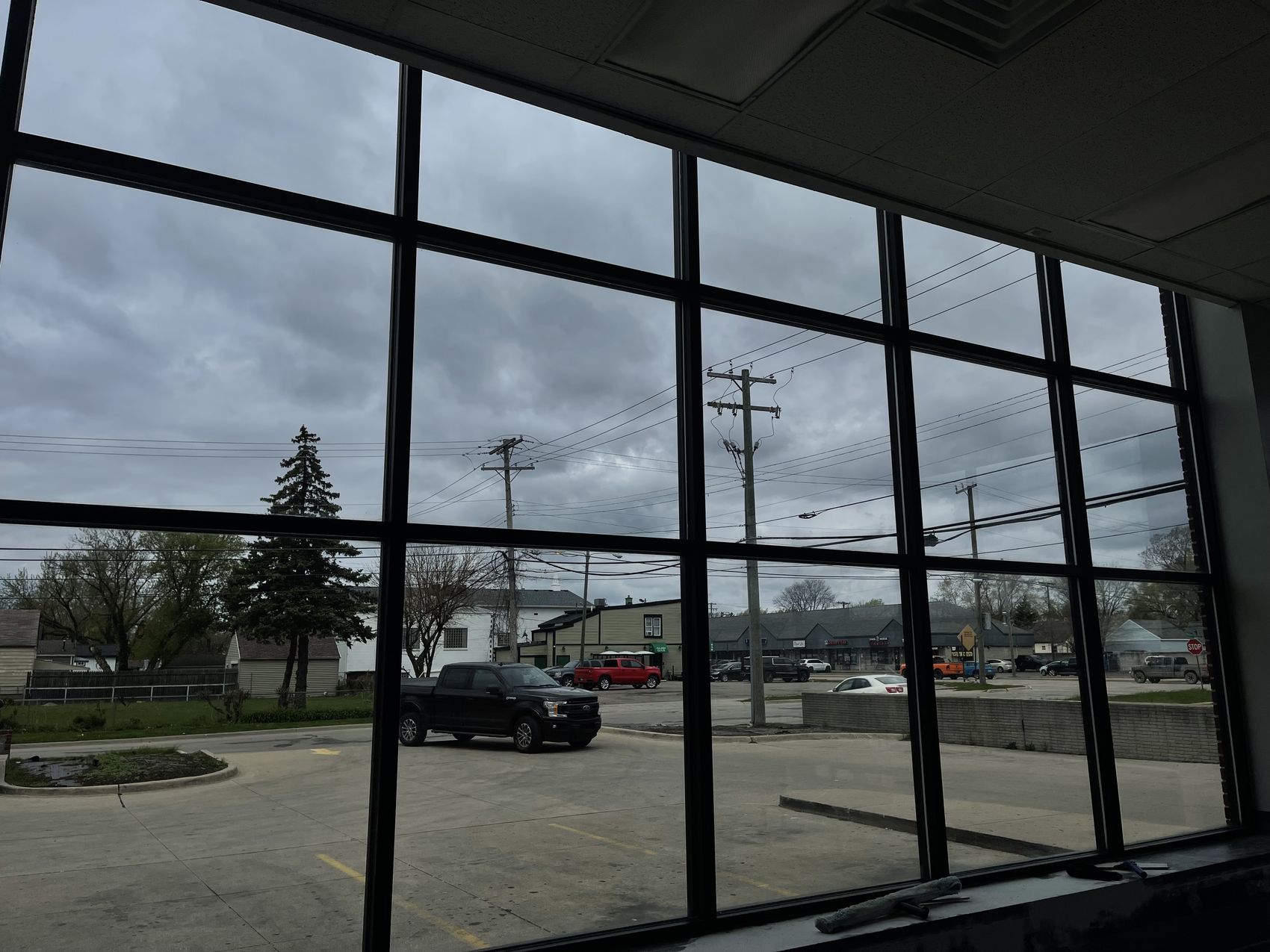 Freshly cleaned floor-to-ceiling storefront windows by Universal Window Cleaning in metro Detroit